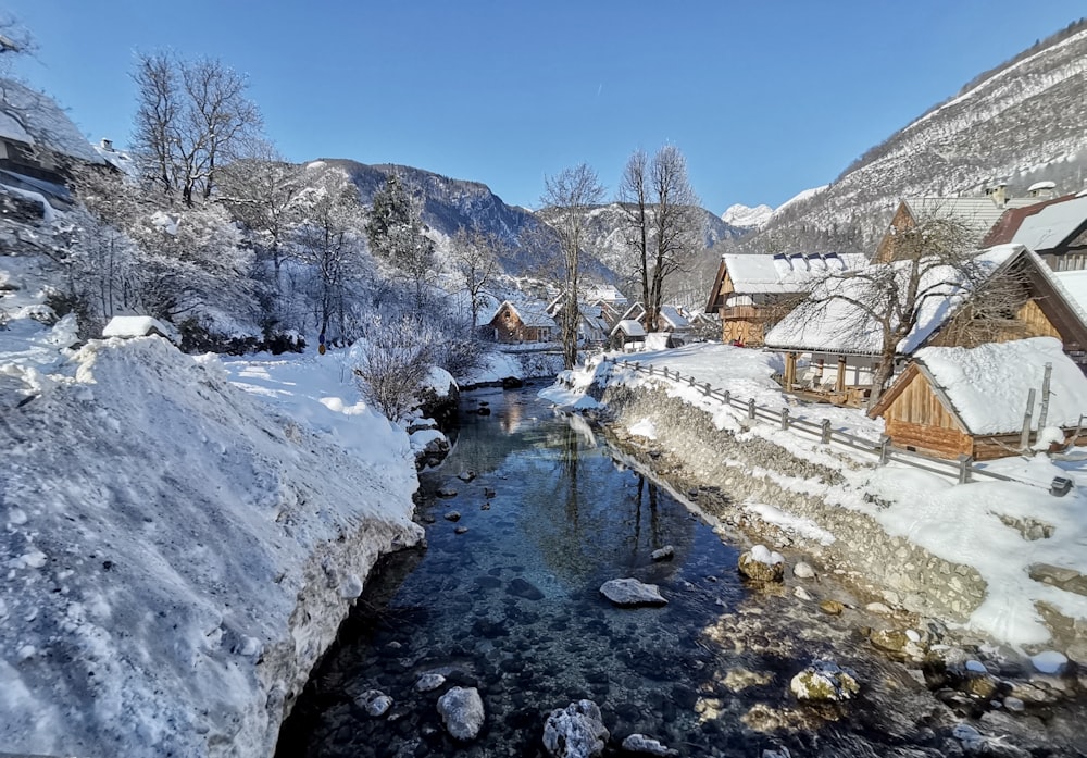 a river running through a snow covered hillside