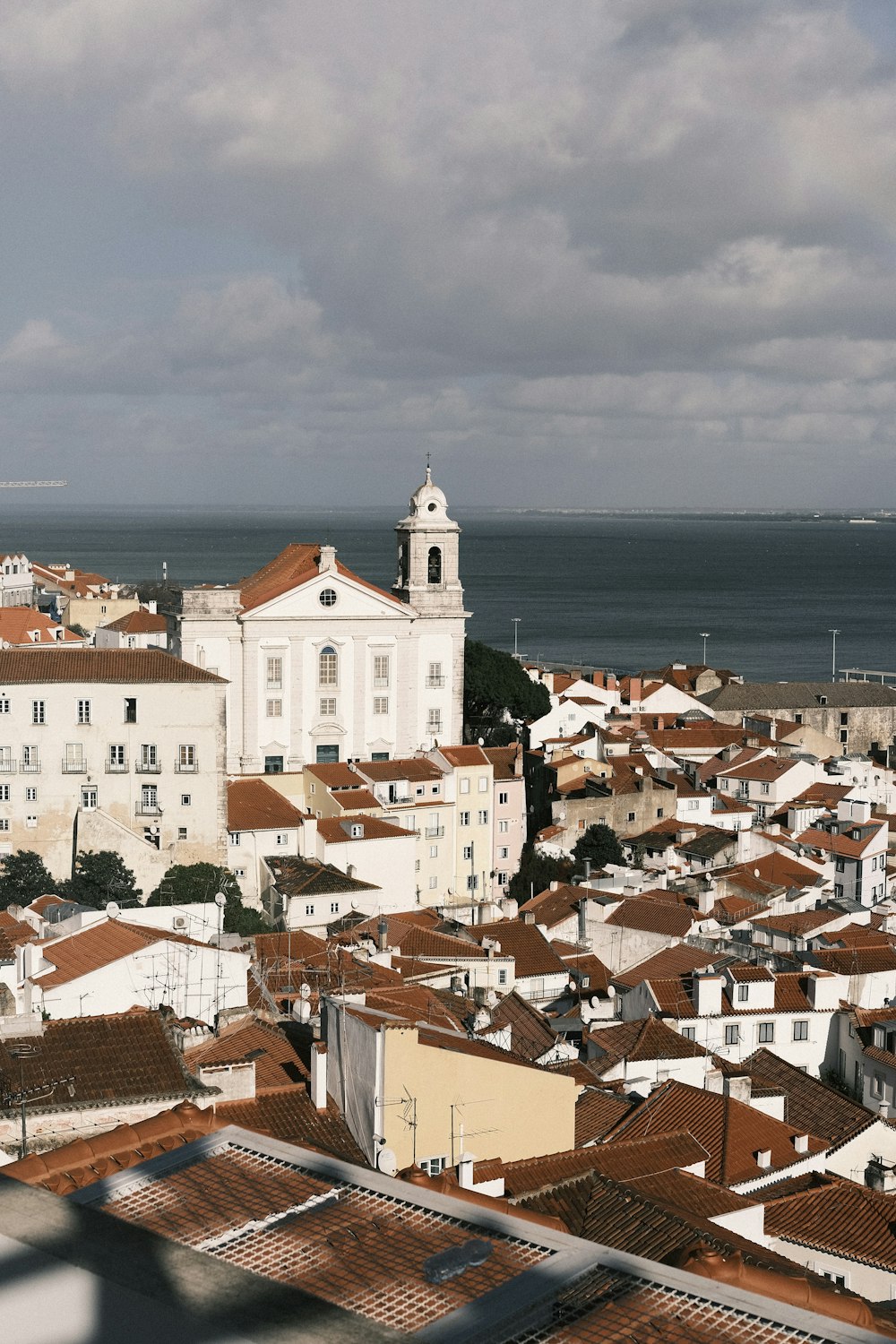 a view of a city with a large body of water in the background