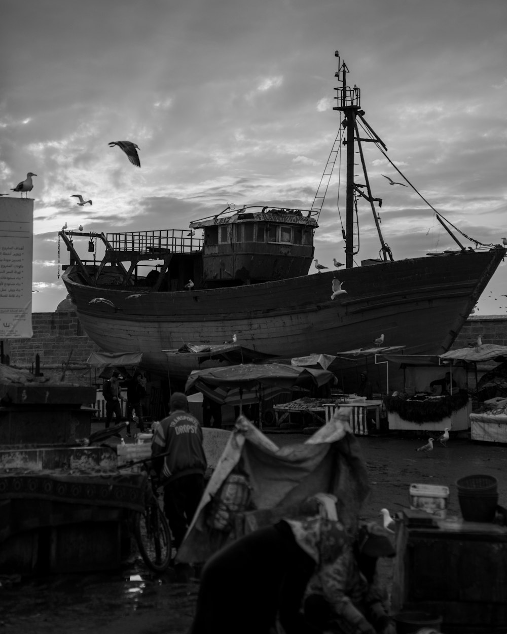 a black and white photo of a boat in the water