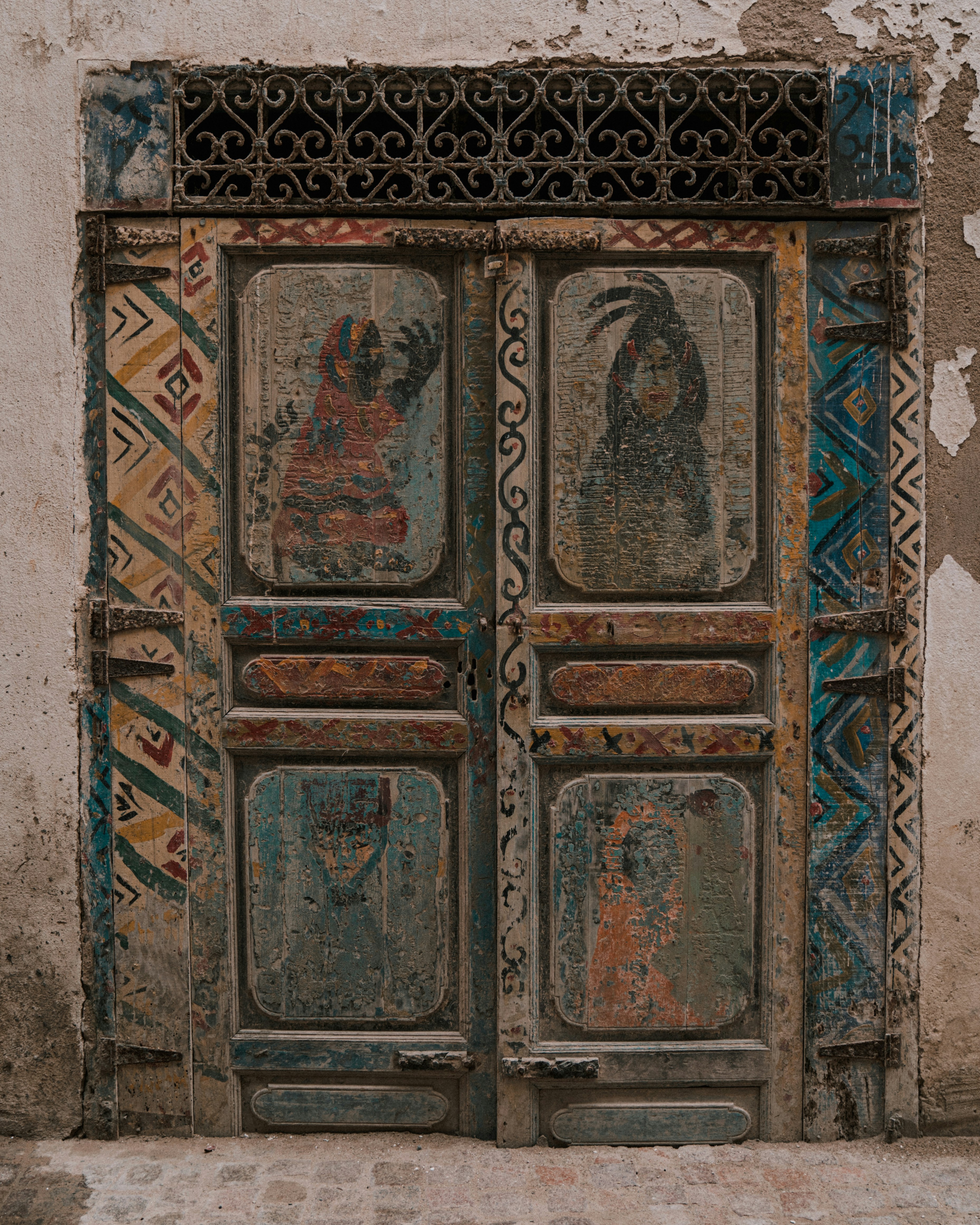 an old door with a painting on it