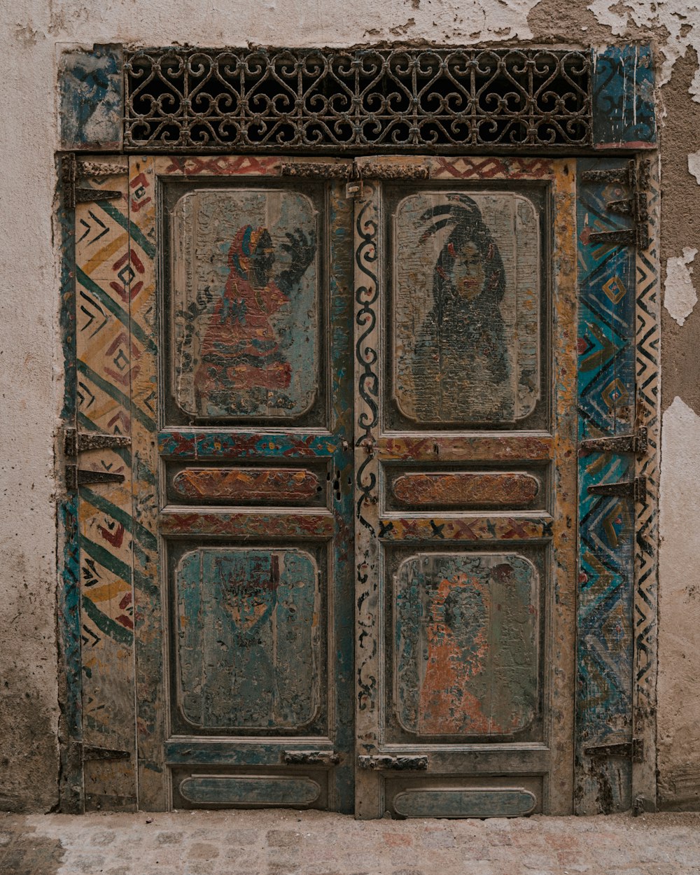 an old door with a painting on it