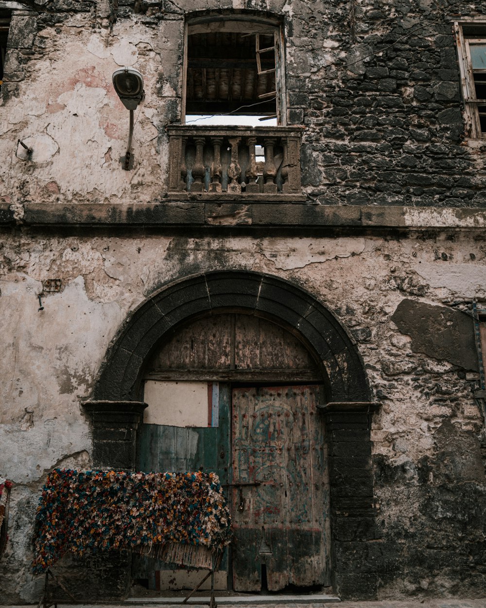 an old building with a bicycle parked in front of it