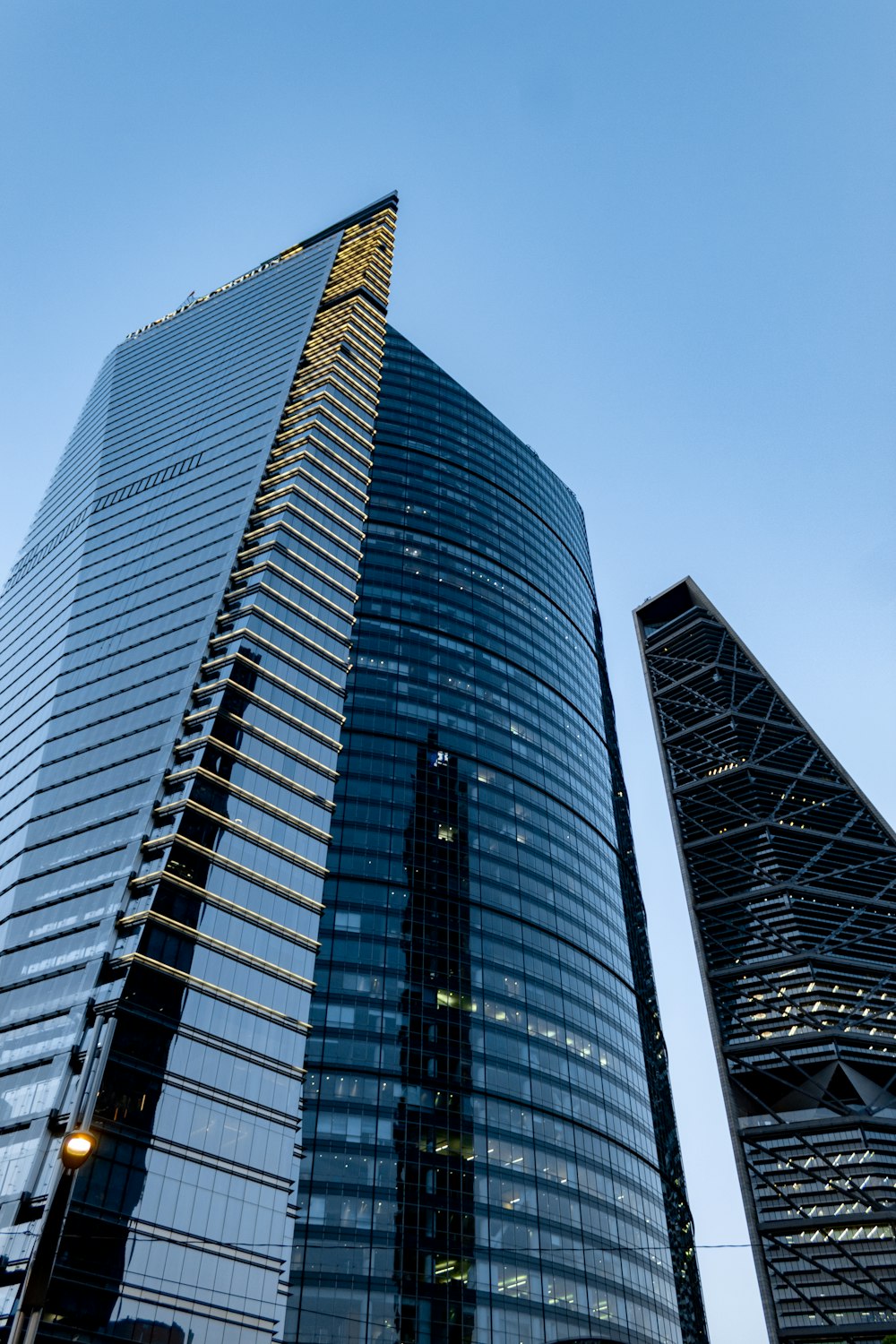 a very tall building sitting next to another tall building