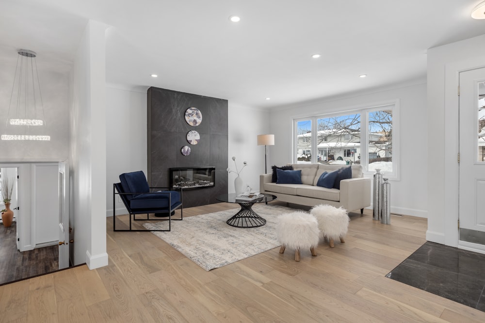 a living room filled with furniture and a fire place