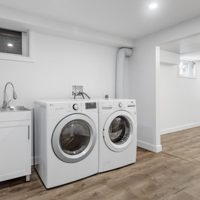 a laundry room with a washer and dryer