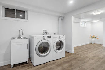 a laundry room with a washer and dryer