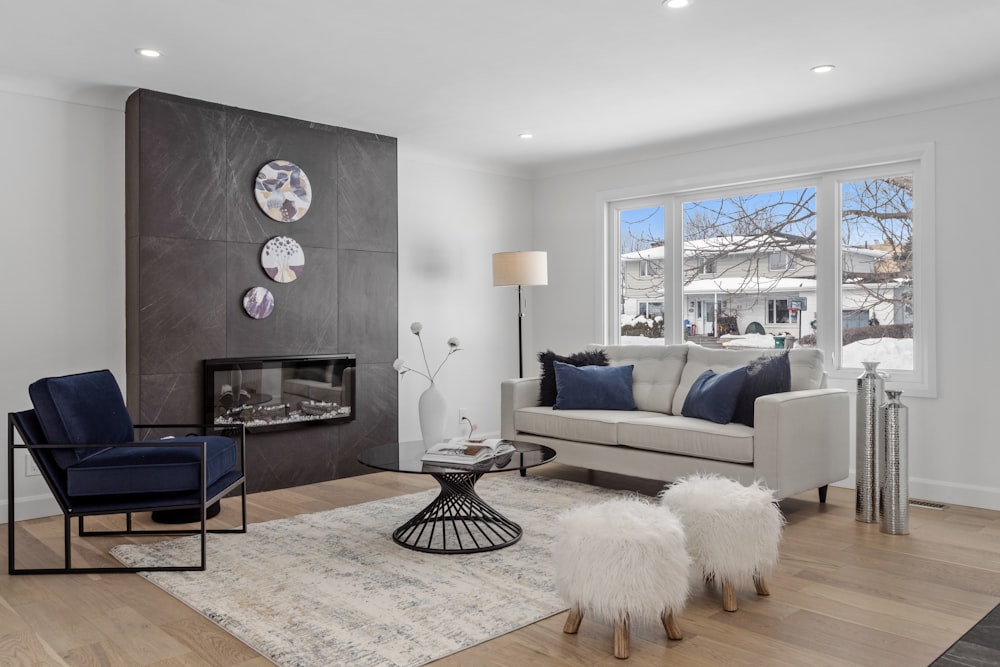 a living room filled with furniture and a fire place