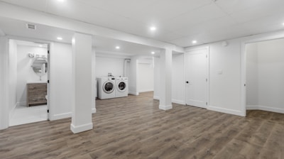 an empty room with a washer and dryer