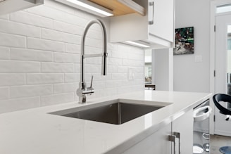 a kitchen with a sink and a window