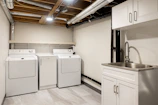 a laundry room with washers and dryers in it