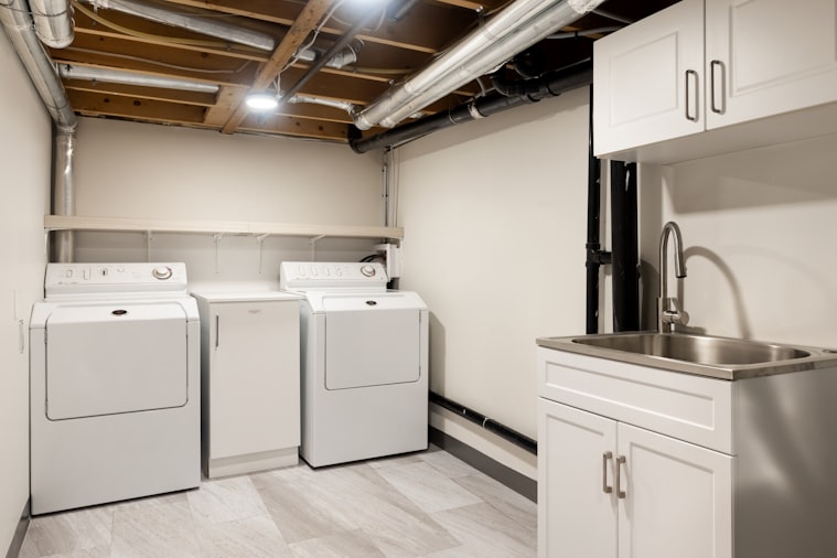 Basement floor coating Knoxville TN — clean finished basement with coated concrete floor