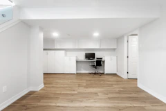 an empty room with a desk and a chair