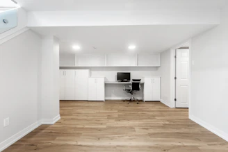 an empty room with a desk and a chair
