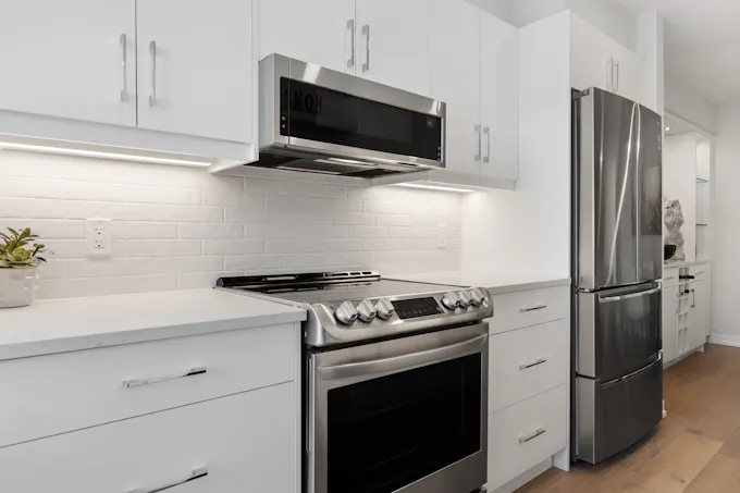 Stainless steel GE-style kitchen appliances in a home serviced by an Altoona appliance repair technician