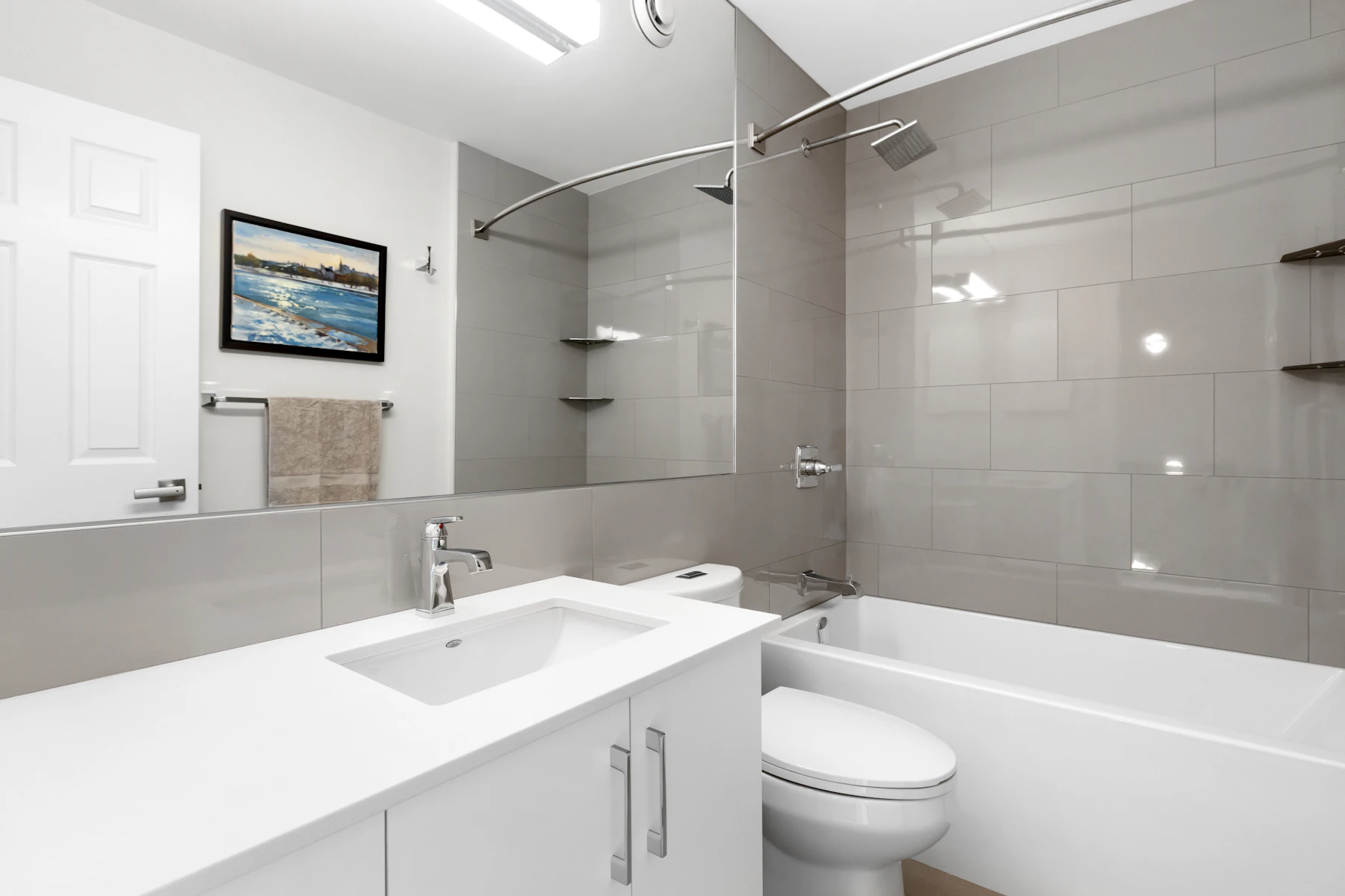 Modern bathroom with sink, toilet, and bathtub