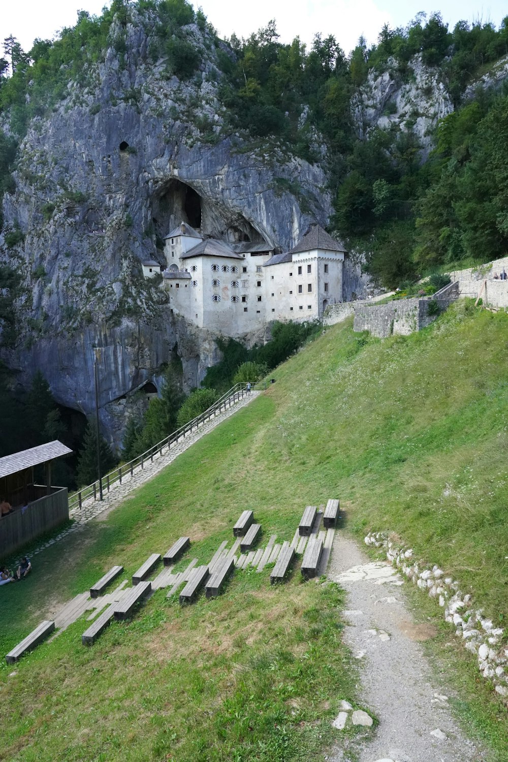 a bunch of benches sitting on the side of a hill