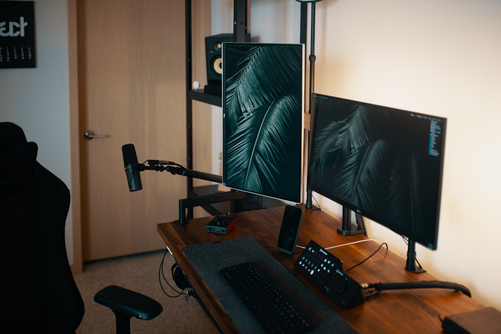 a computer desk with a monitor and keyboard