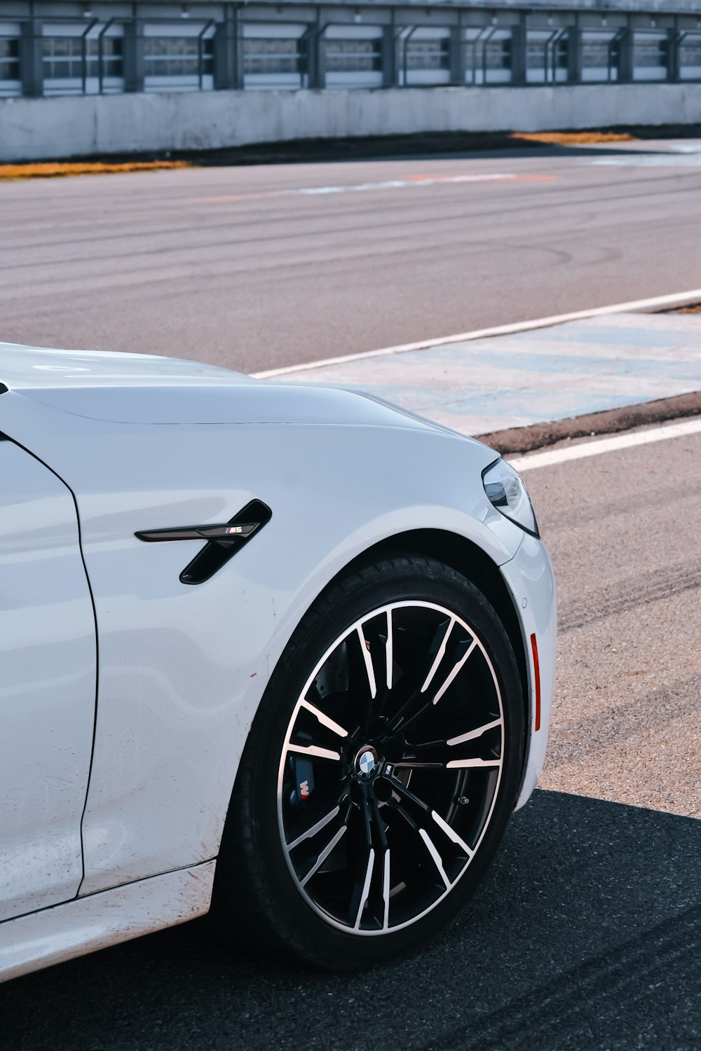 a white car parked on the side of the road