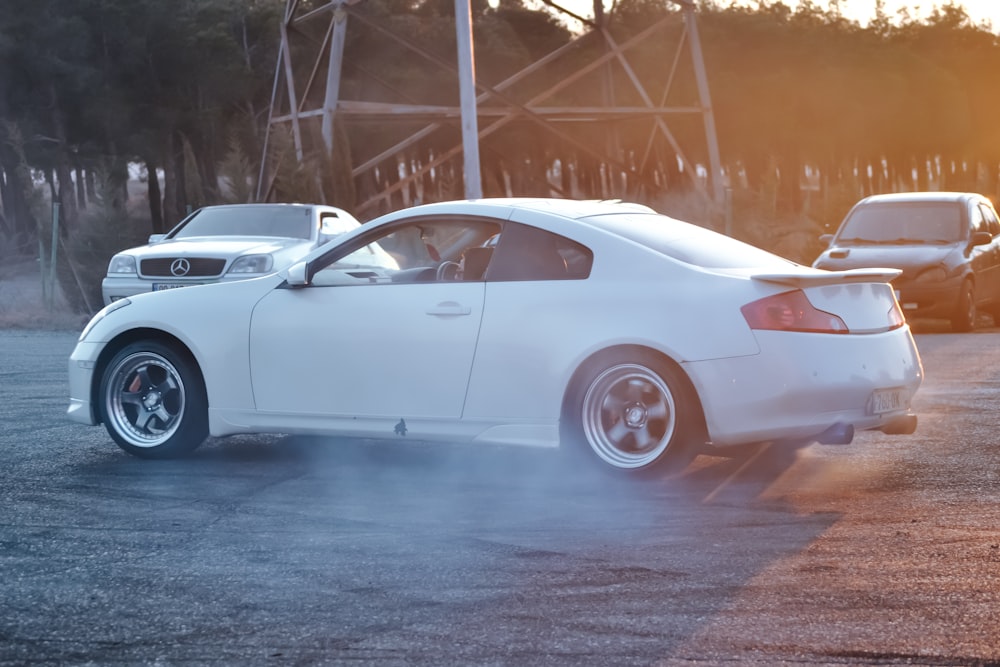 a white sports car in a parking lot