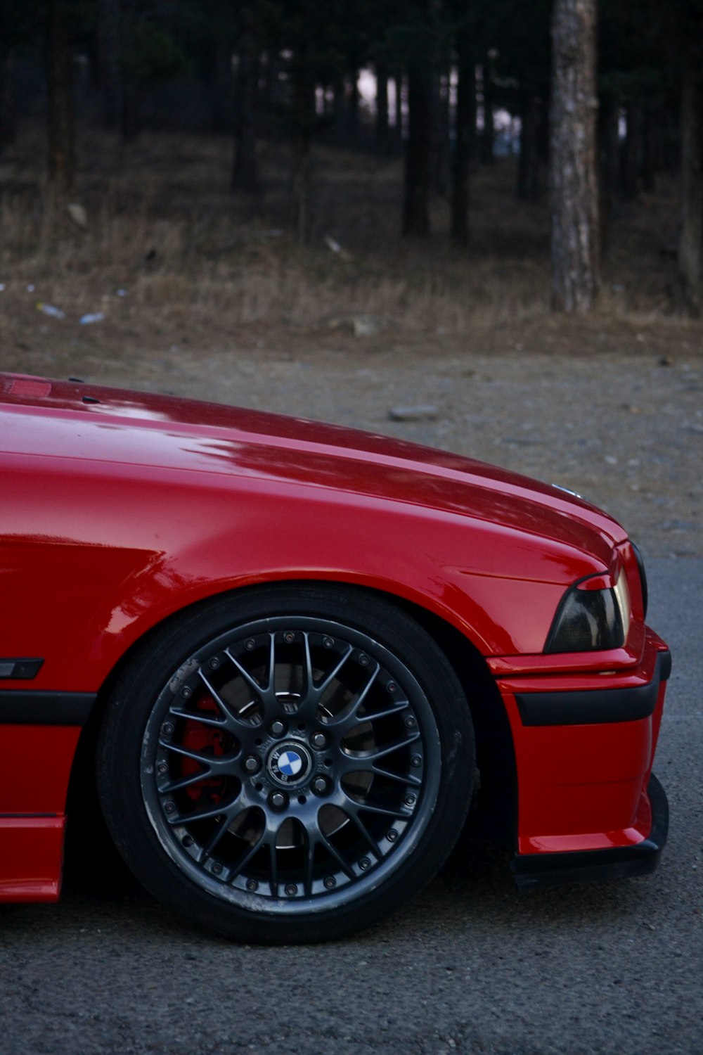 a red car parked on the side of the road