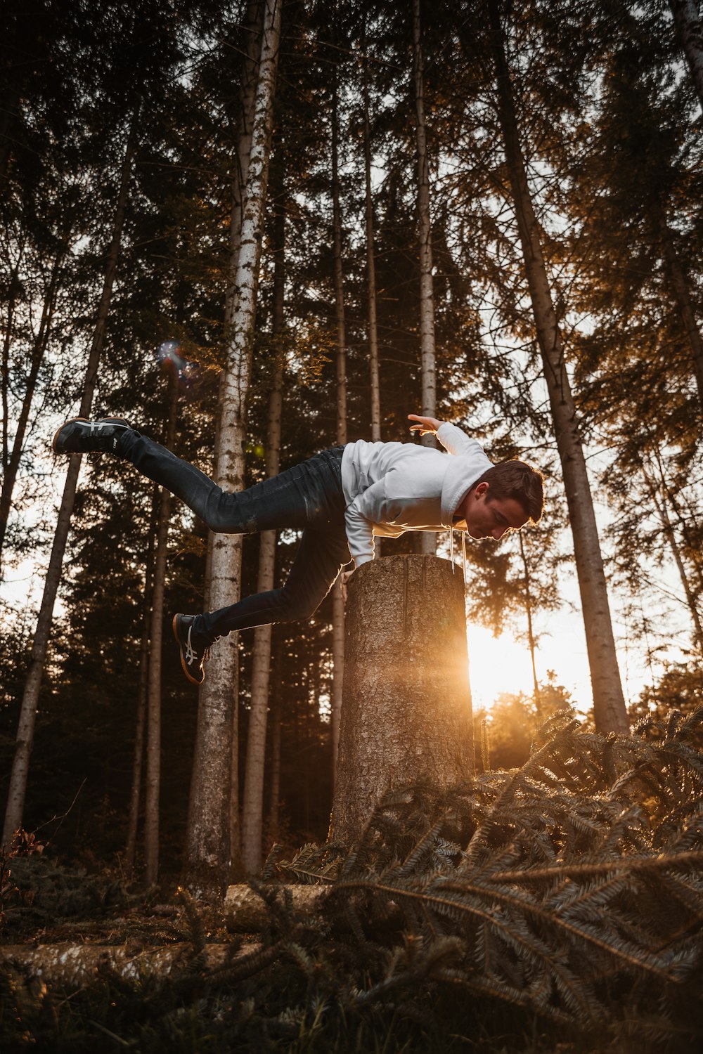 a man flying through the air while riding a skateboard