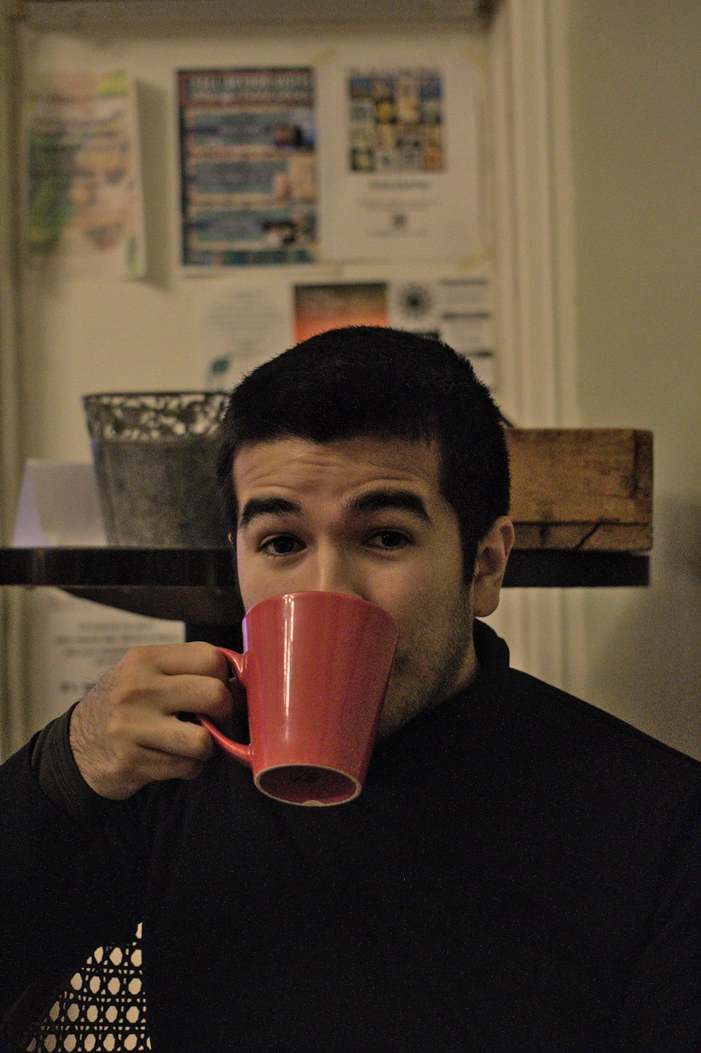 a man holding a coffee cup in his hand