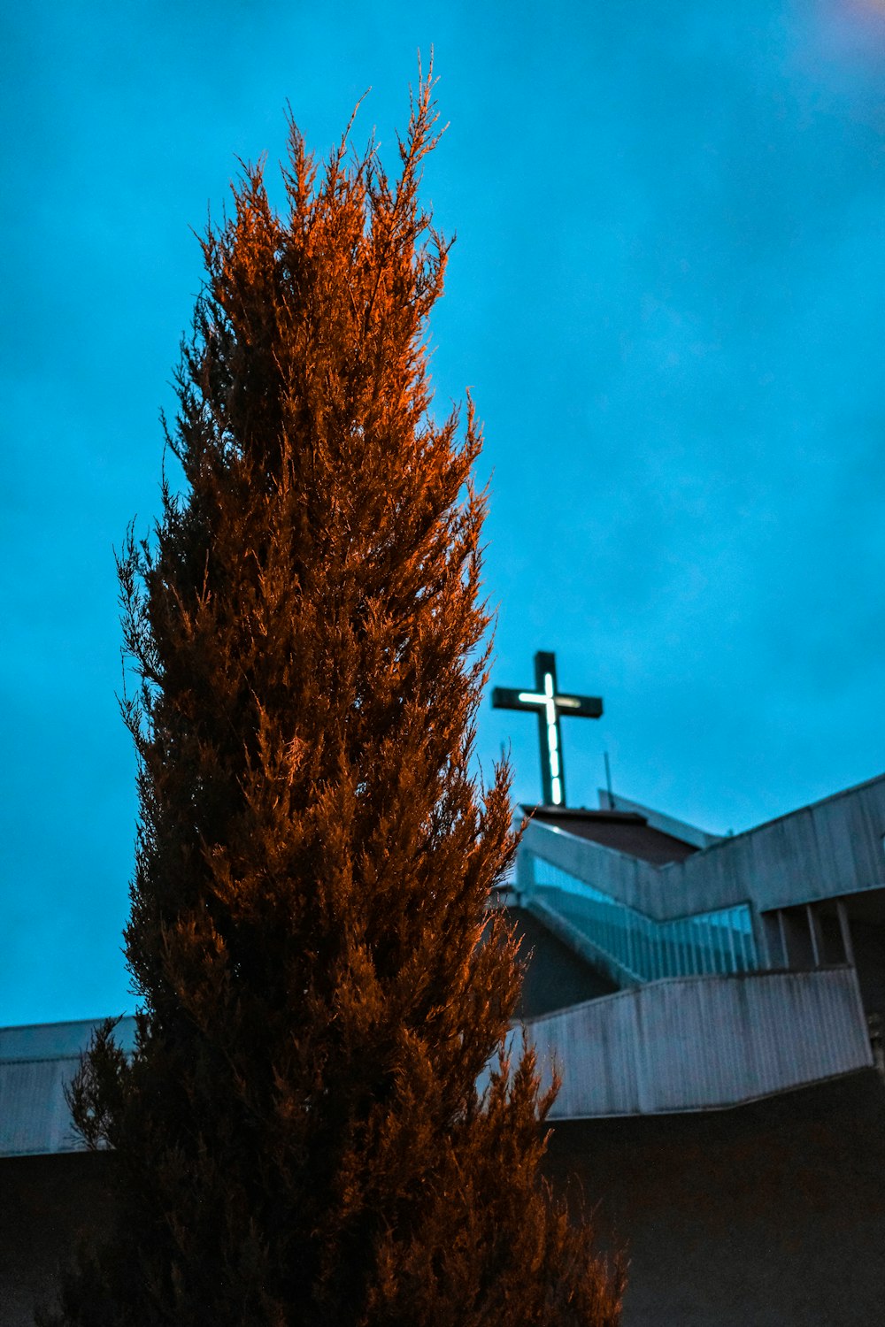 a church steeple with a cross on top of it