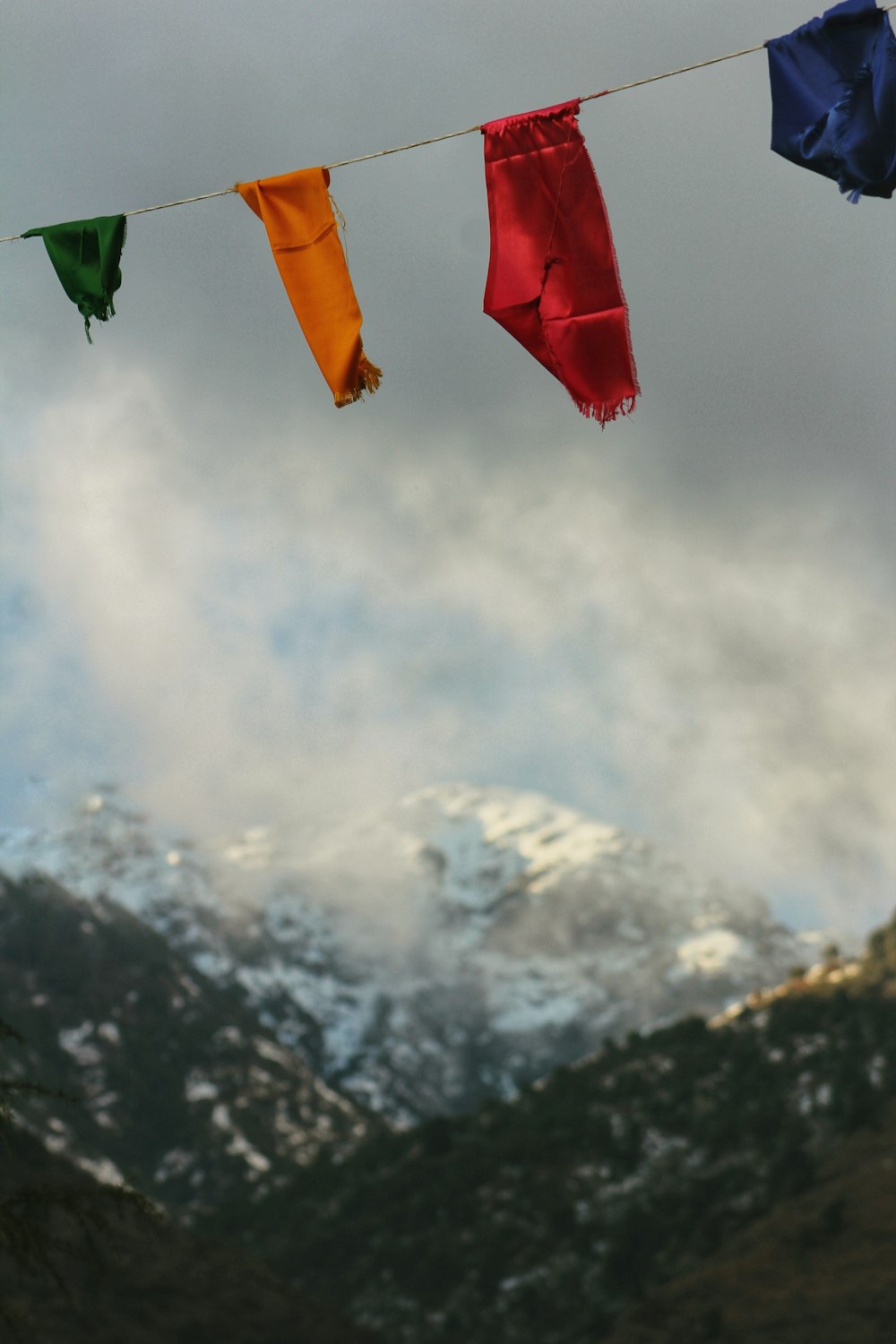 a group of colorful flags hanging from a line