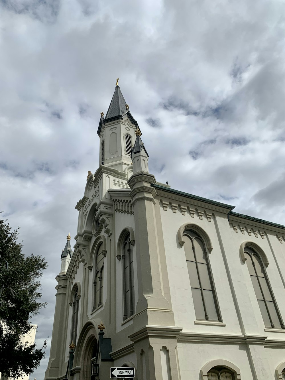 a large white building with a clock tower