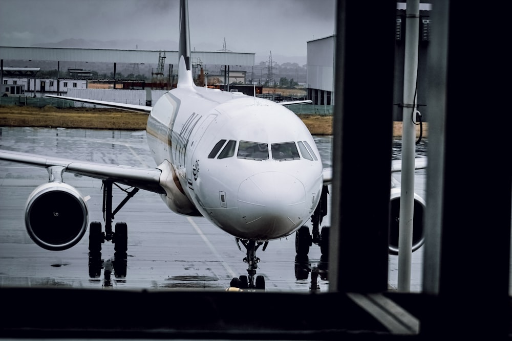 a large jetliner sitting on top of an airport tarmac