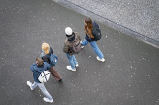 a group of people walking down a street