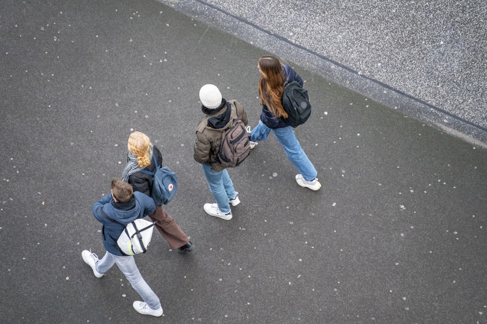 a group of people walking down a street