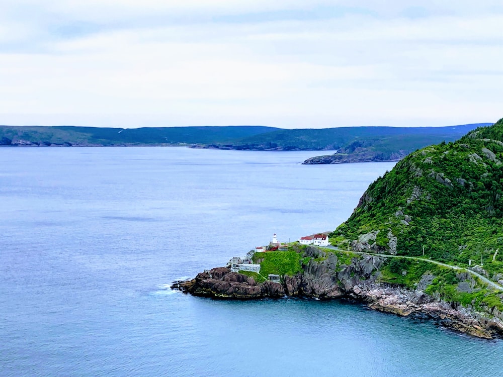 a scenic view of the ocean with a road going through it