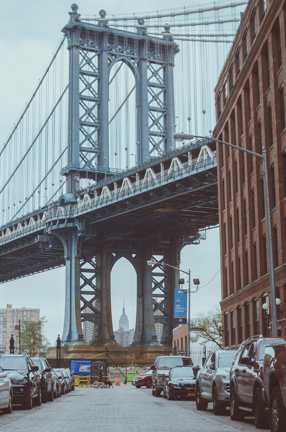 a large bridge spanning over a city street