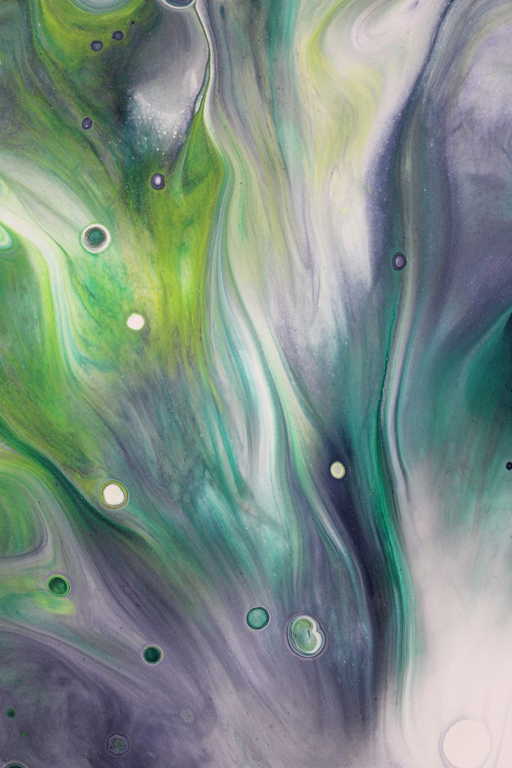 an abstract painting with green and purple colors