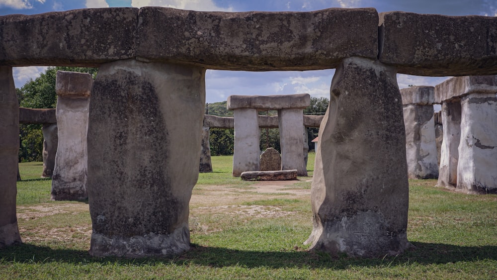 a large stone structure in a grassy area