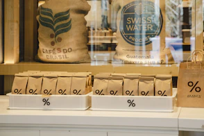 a store window with bags of coffee on display