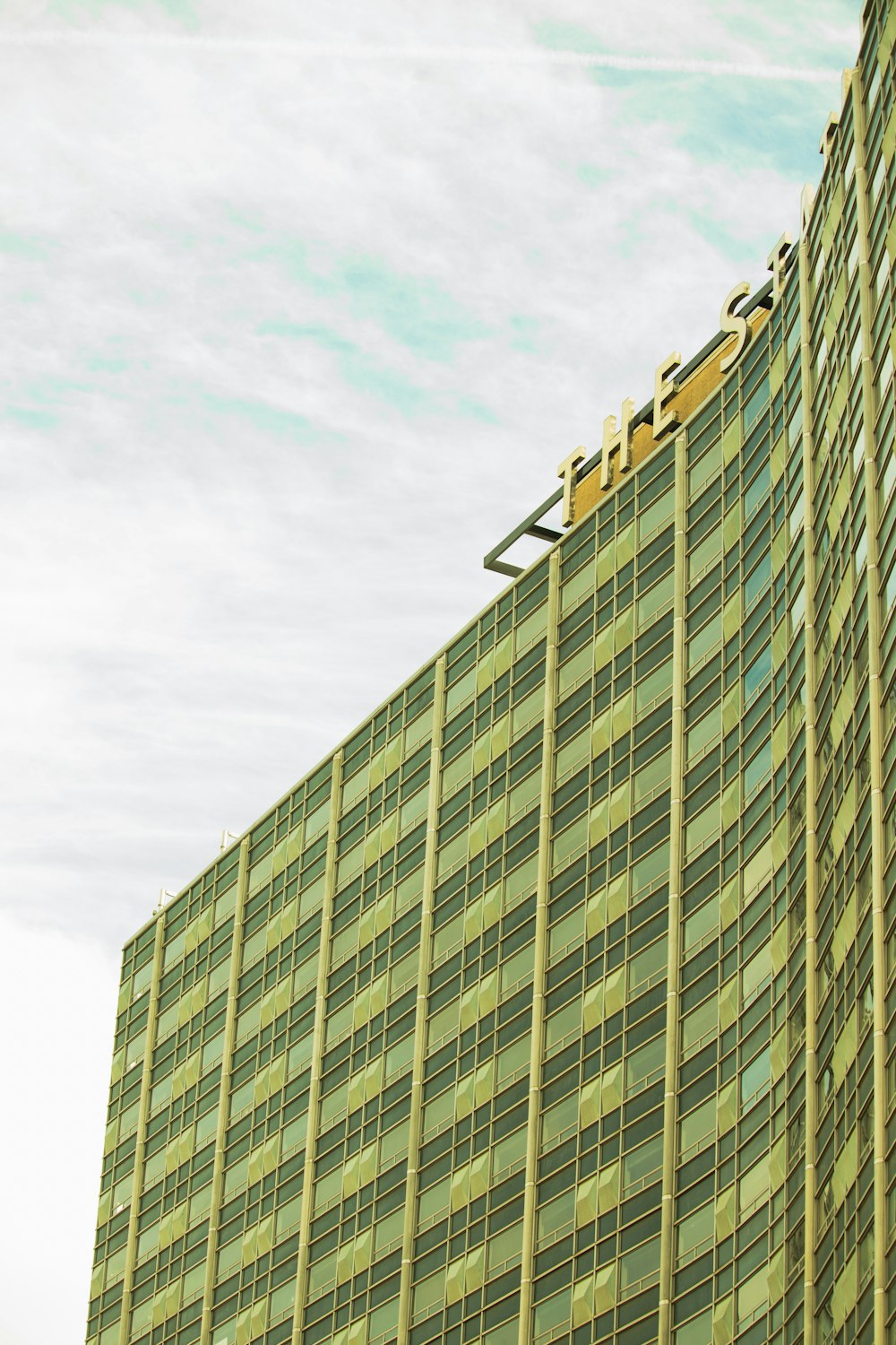 a very tall building with a sky background