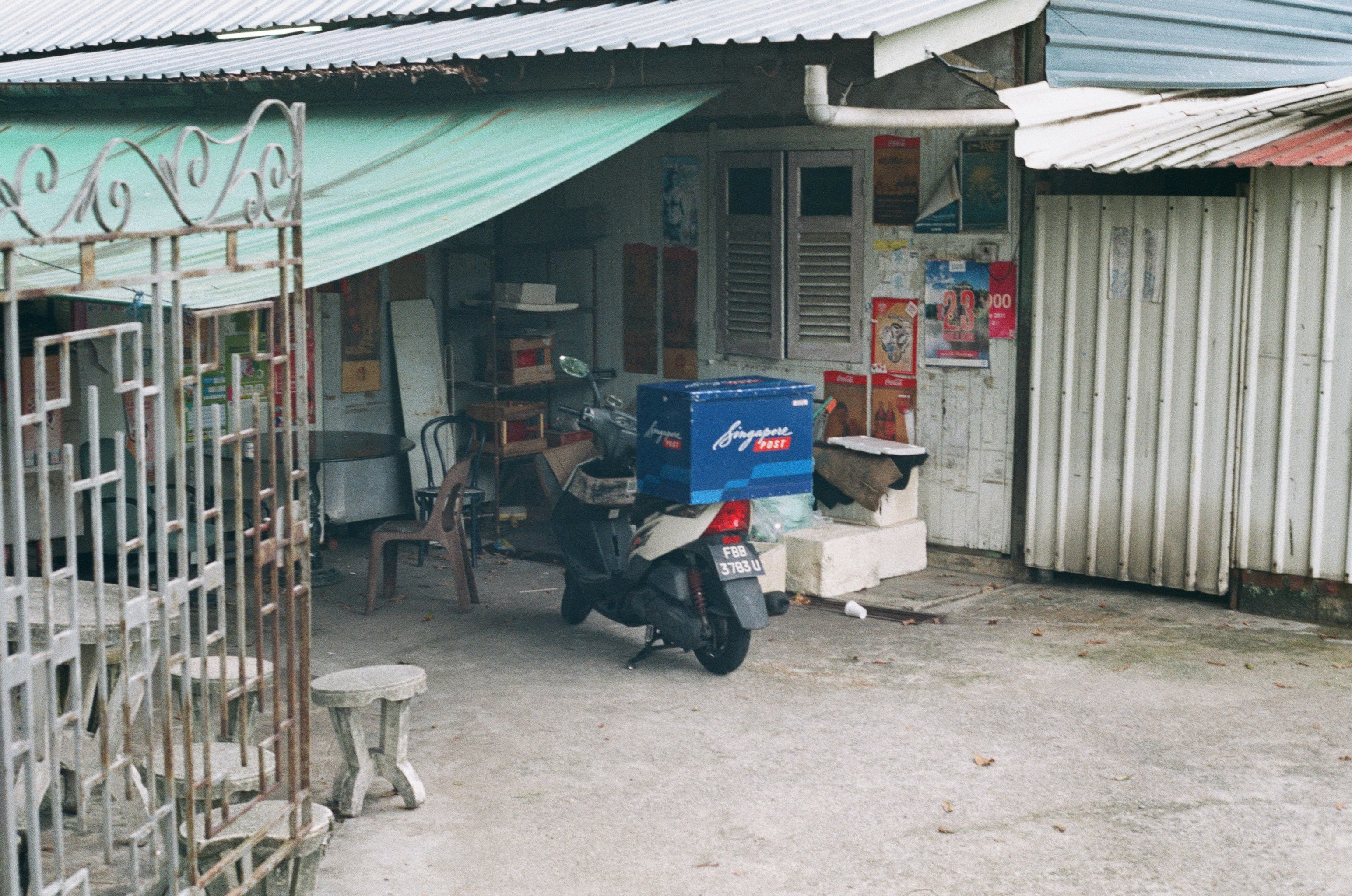 a motor scooter parked in front of a building