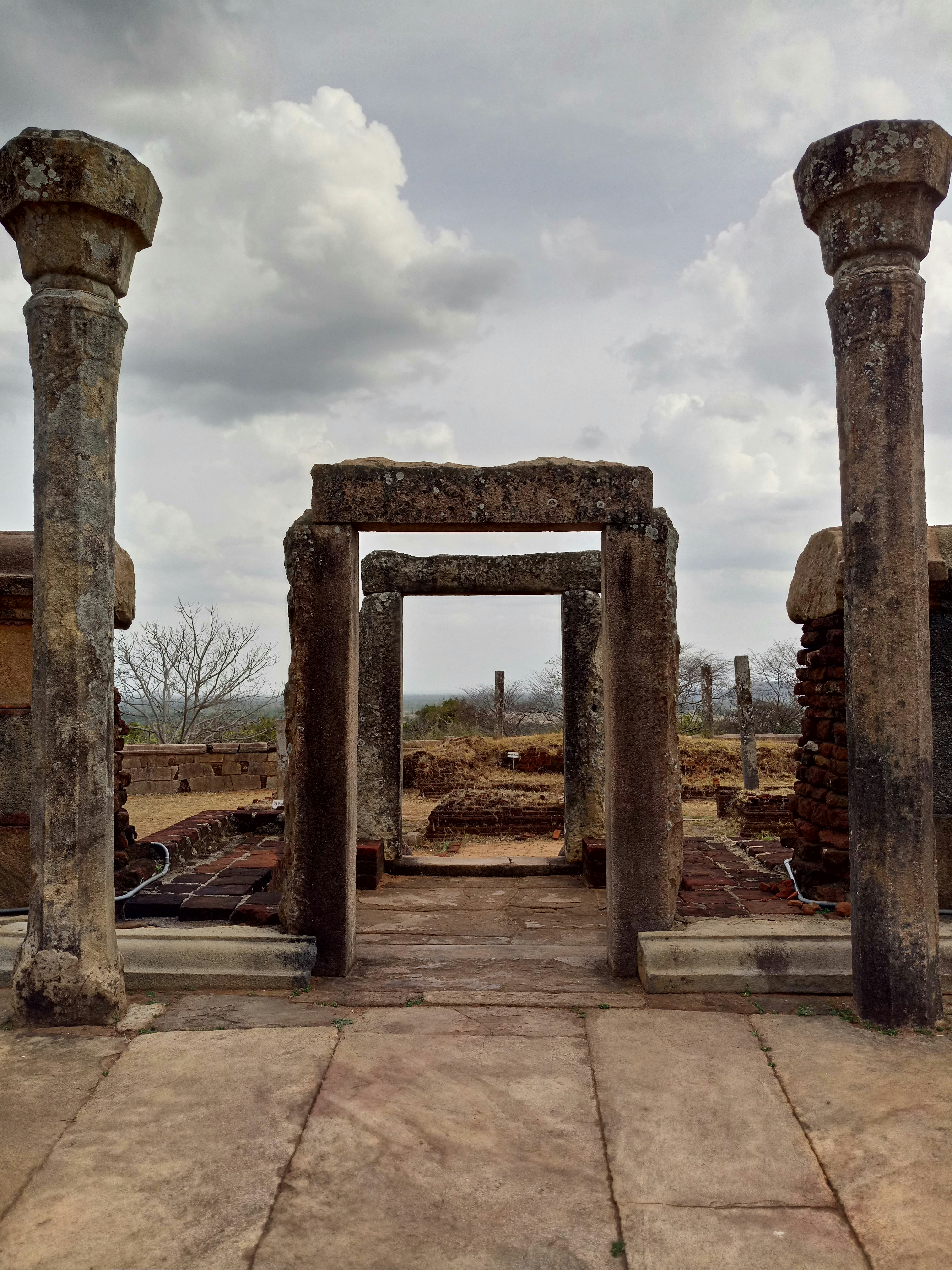 a group of stone pillars sitting next to each other