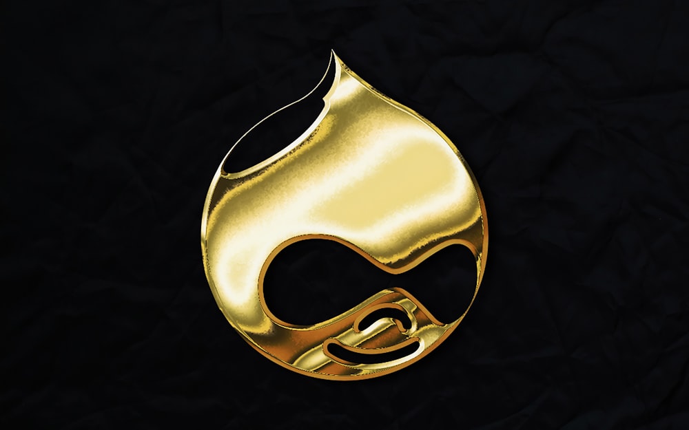 a gold mask on a black background