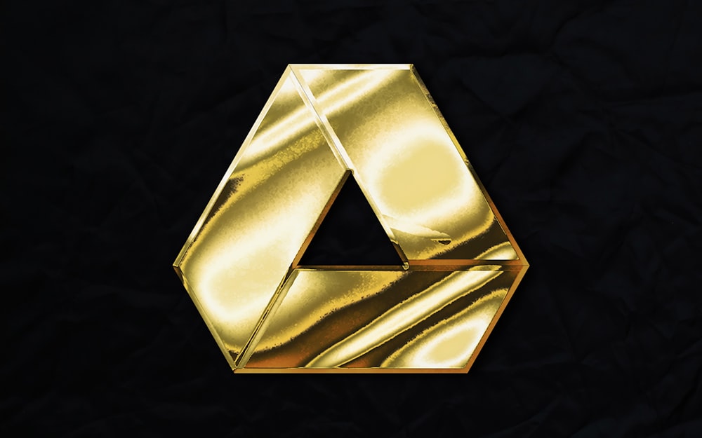 a gold letter on a black background