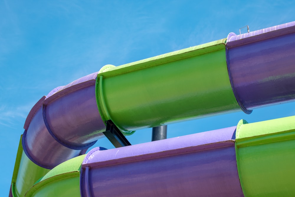 a close up of a water slide against a blue sky