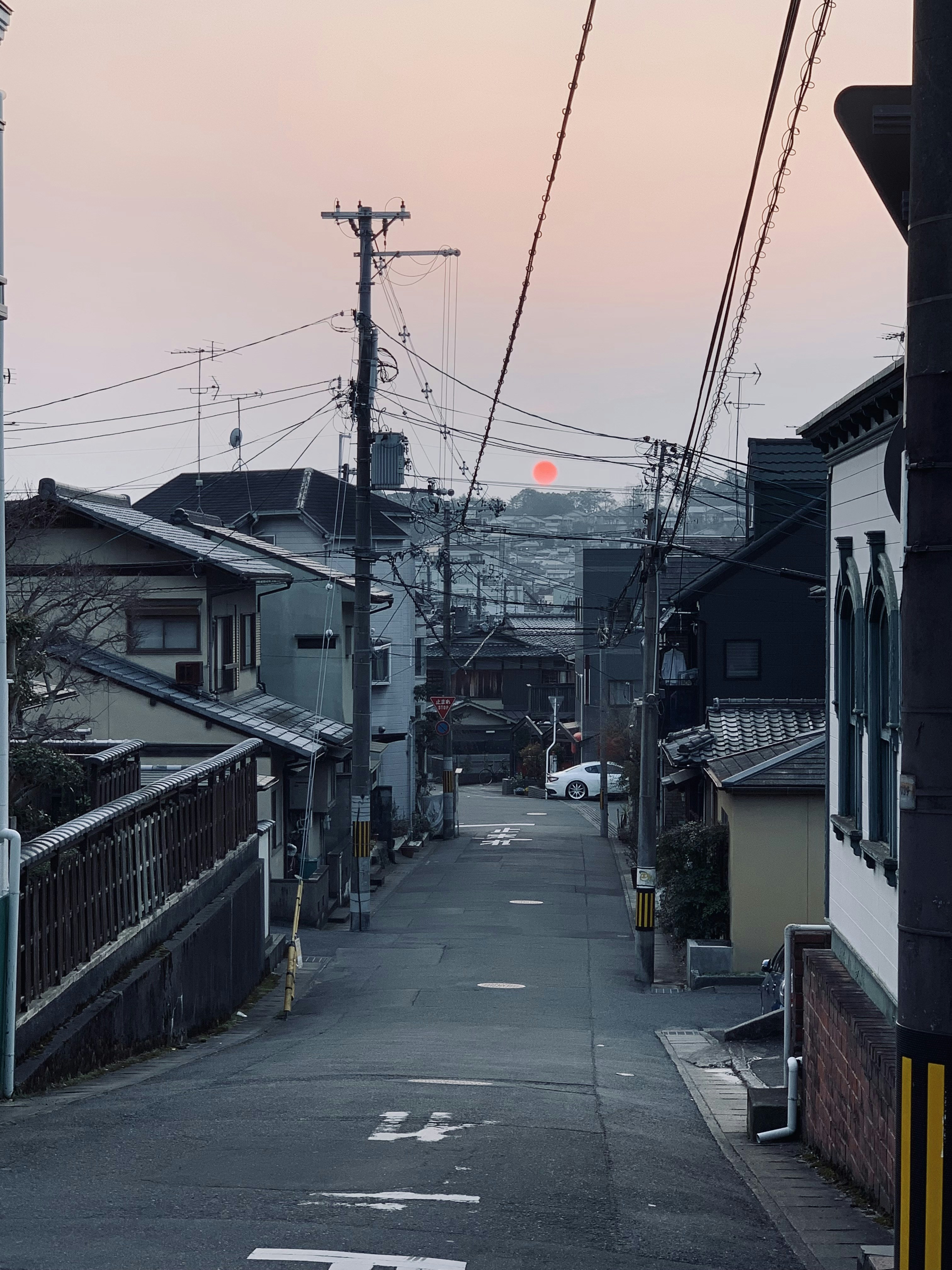 a city street with power lines above it