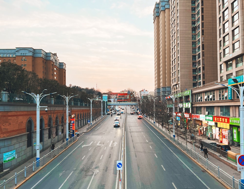 an empty street in a city with tall buildings