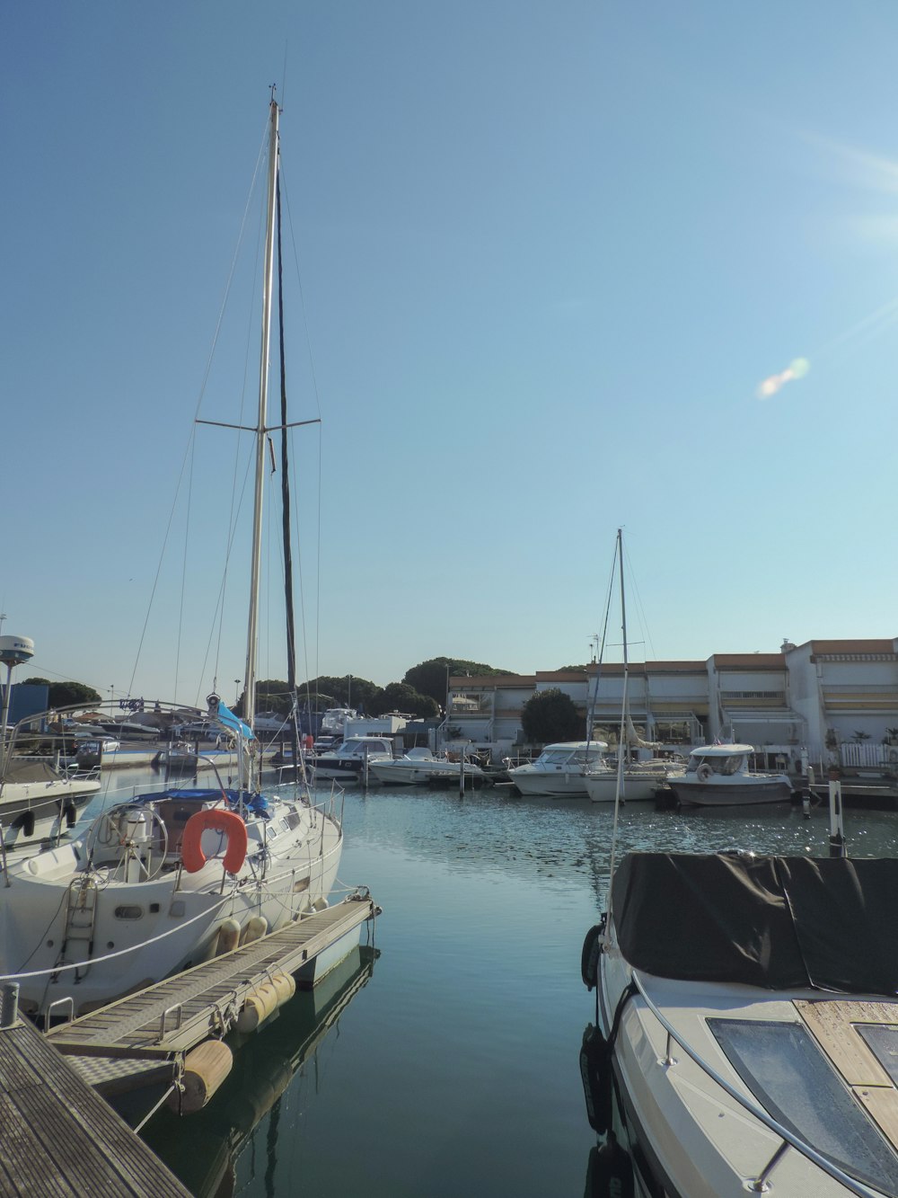 a marina filled with lots of boats on top of water