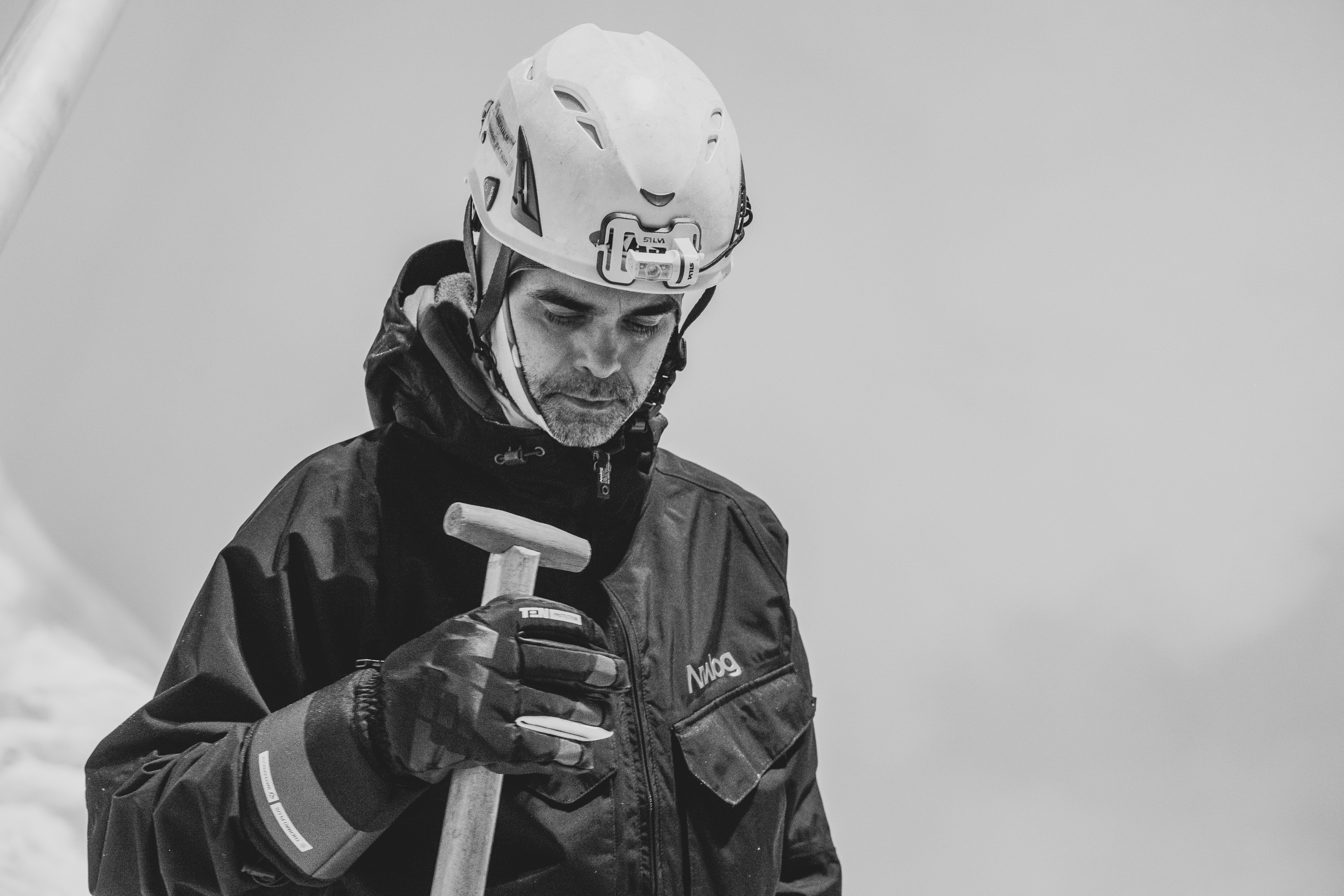 a man wearing a helmet and holding a baseball bat