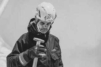 a man wearing a helmet and holding a baseball bat