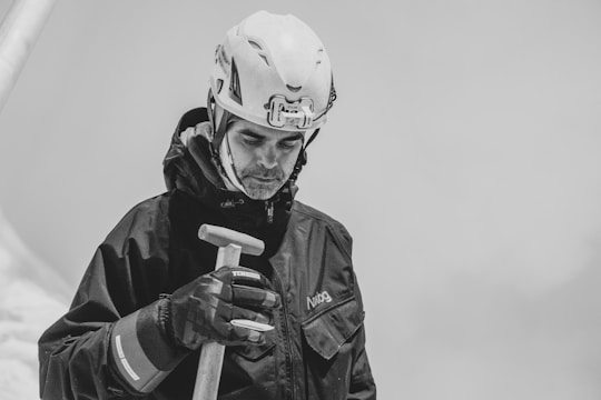 a man wearing a helmet and holding a baseball bat