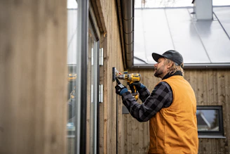 electrician installing outside light